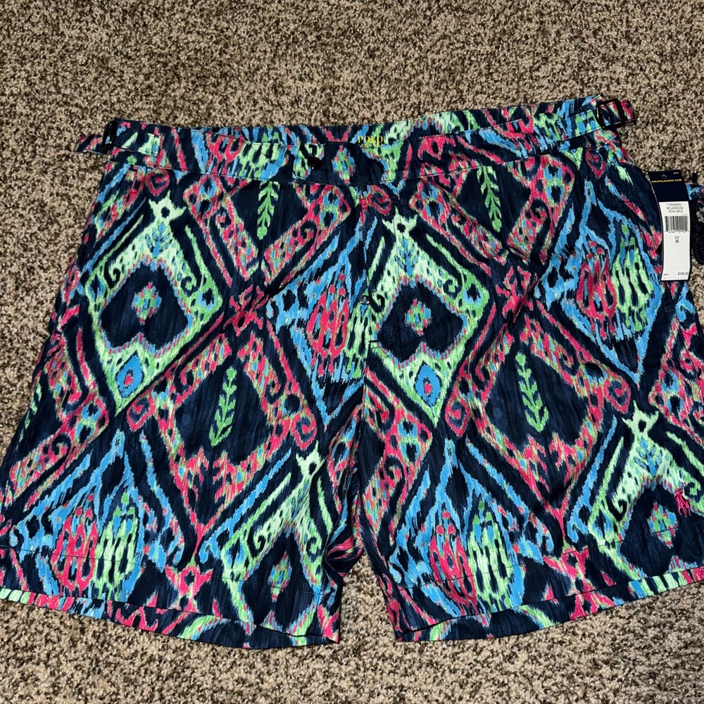 Men’s swim trunks NWT never worn.  Comes with matching travel bag